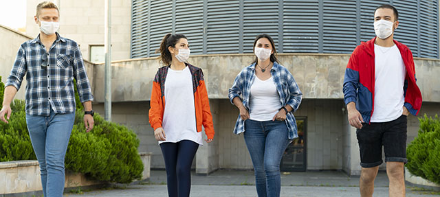 photo - 17-Year-Olds Wearing Mask and Walking in Line
