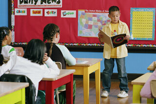 photo - Elementary School Student Giving a Presentation