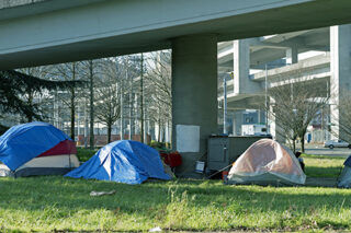 Homeless Encampment Below Freeway In Seattle WA
