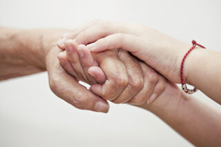 OlderandYoungerHandHolding