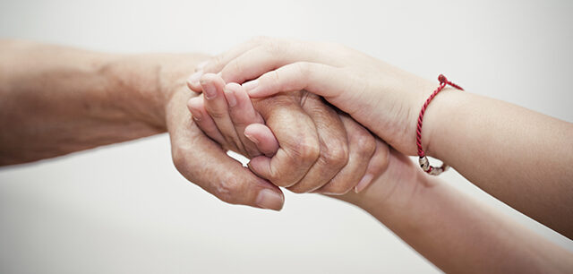 OlderandYoungerHandHolding