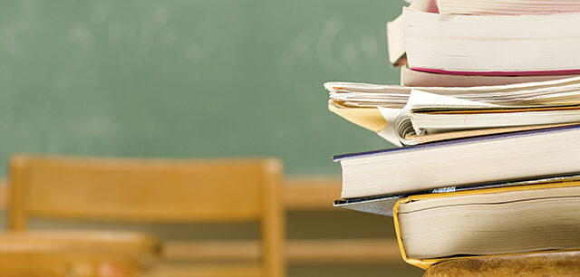 Pile Of Books On A Desk