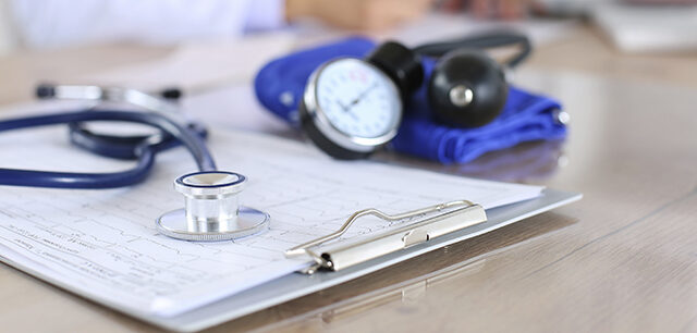 Medical Stethoscope Lying On Cardiogram Chart Closeup