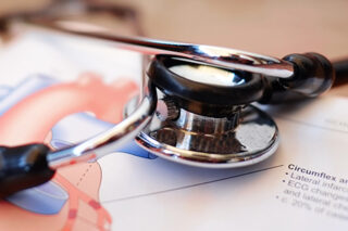 Medical Book And Stethoscope