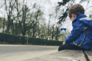 Boy Alone On Bench