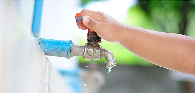 Child Turning on WaterFaucet