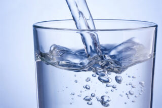 photo - Water Pouring Into Glass