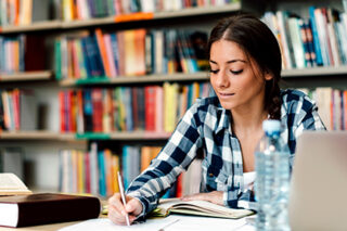 Photo of college student in the library