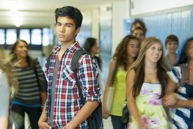 latino high school student in hallway
