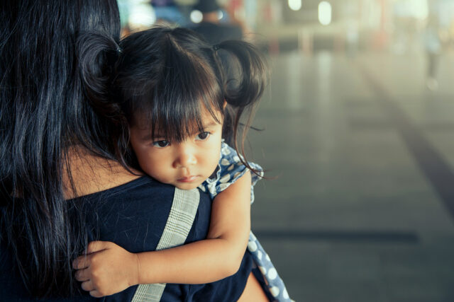 photo - Little Girl Held By Mother