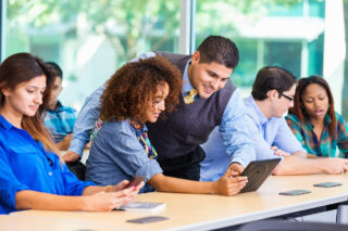 photo - College Student and Professor in Class