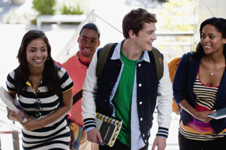 Photo of students climbing steps together