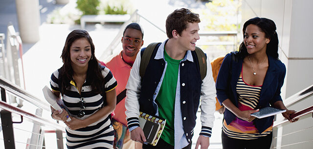 Photo of students climbing steps together