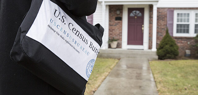 photo = Census Field Worker Approaching House