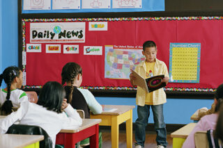 photo of child reading in classroom