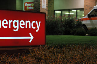 Emergency Room Entrance Sign With Ambulance