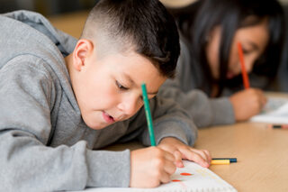 Kids Studying At The School