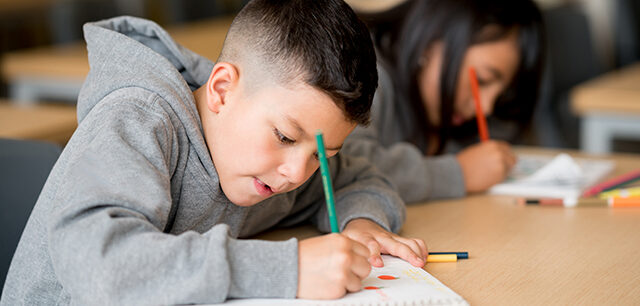 Kids Studying At The School