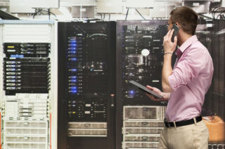 photo - Programmer Talking on Phone