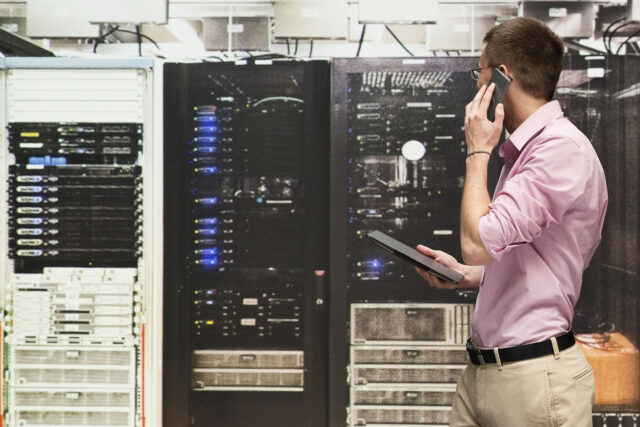 photo - Programmer Talking on Phone