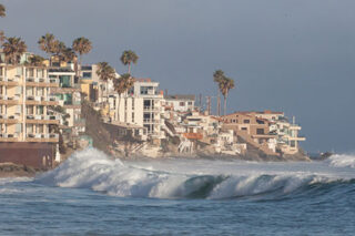 photo - Ocean Waves Hitting Housing on Southern California Coastal Housing