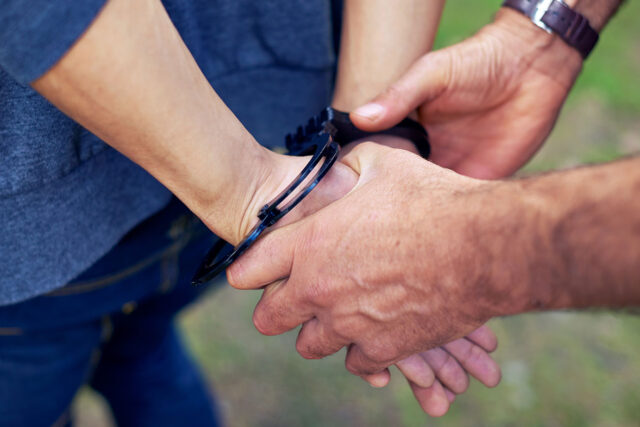 photo - Man in Handcuffs