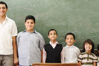 students in front of blackboard