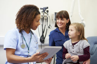 photo - photo - Mother and Daughter Talking with Doctor