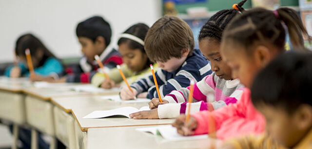 photo - Elementary Students at Desks Taking Test