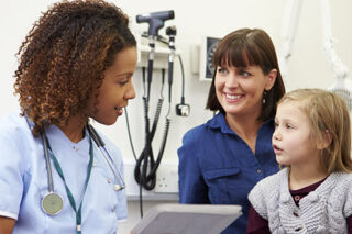 photo - Mother and Daughter Talking with Doctor