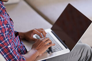 Man At Laptop Computer At Home Getty 501799711