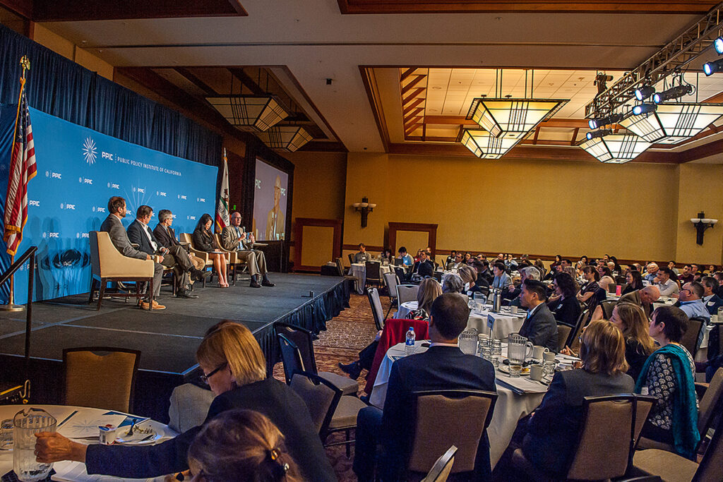 Photo of audience listening to panel 1