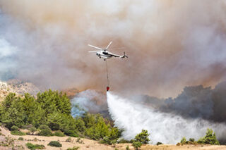 photo - Helicopter Dropping Water for Fire Fighting