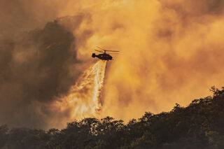 photo - Helicopter Dumping Water on Forest Fire