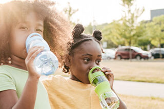 photo - Girls Drinking from Water Bottles
