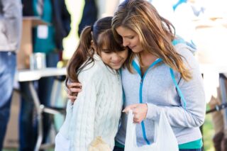 photo - Mother Giving Daughter a Hug