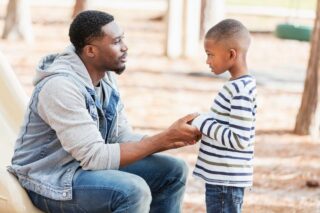 photo - African American man with his son