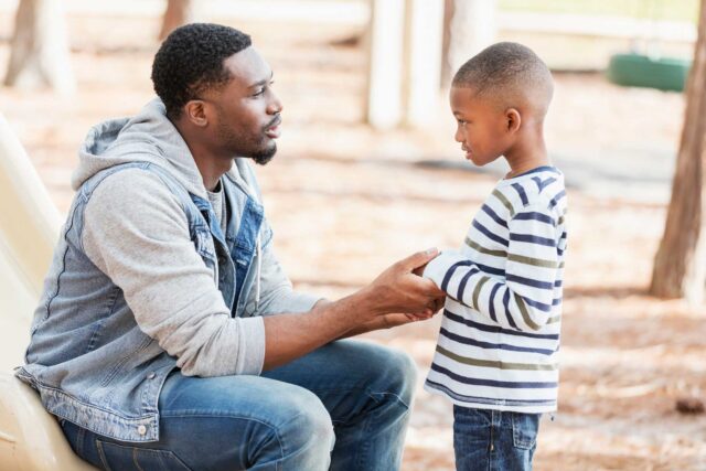 photo - African American man with his son