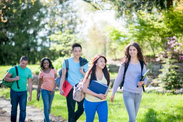 photo - Group of Students Walking to Class on College Campus