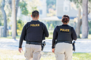 photo - Two Police Officers Walking in the Neighborhood