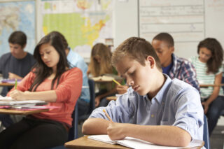 photo - students in a high school classroom taking a test