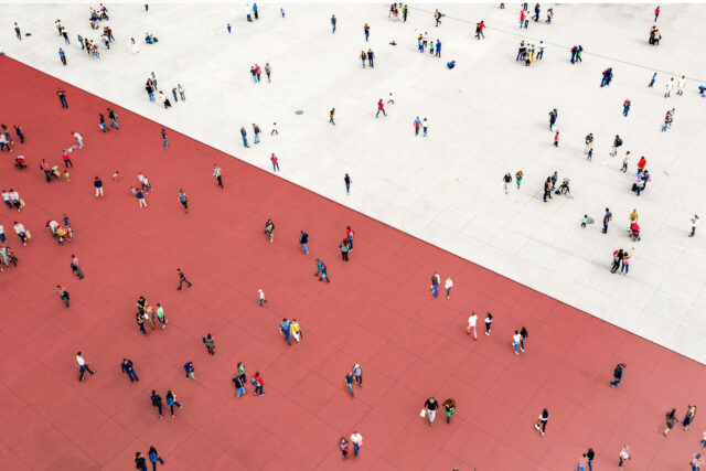 photo - Crowds Standing on Two Separated Zones