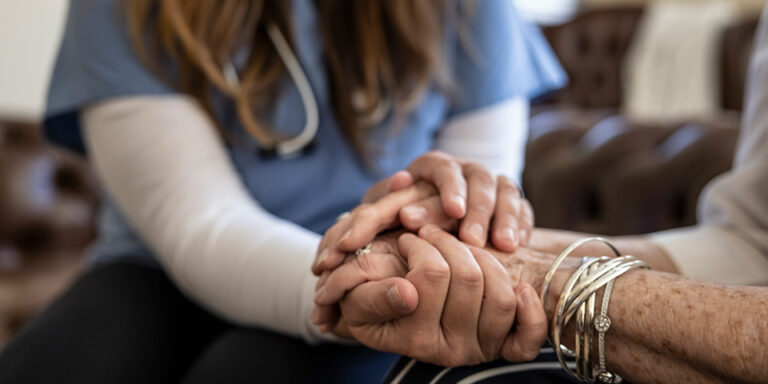 Senior Woman at Home Receiving Healthcare