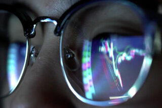 photo - Charts Reflected in Eye Glasses