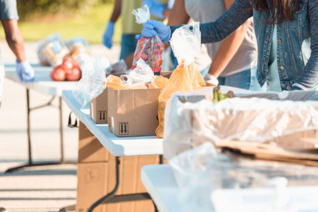 photo - Food Bank Volunteers Boxing Food for Distribution