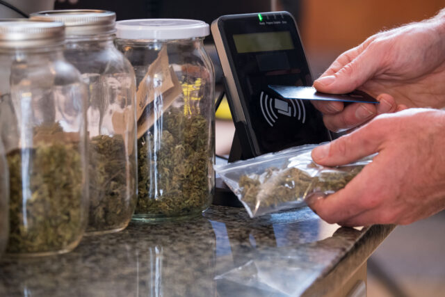 photo - Purchasing Marijuana with Credit Card at Dispensary