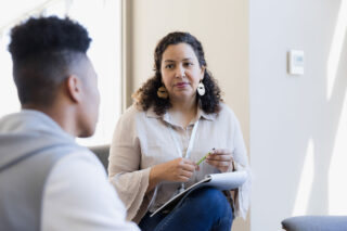 photo - Counselor Listens to Young Adult
