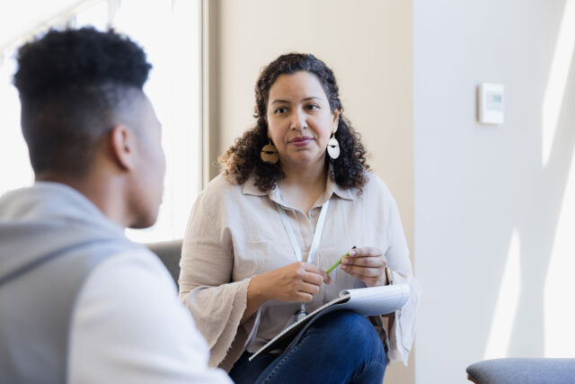 photo - Counselor Listens to Young Adult