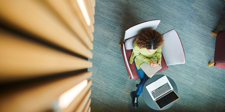 photo - Student in College Library