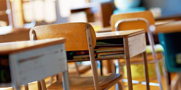 photo - Classroom with Empty Wooden Desks